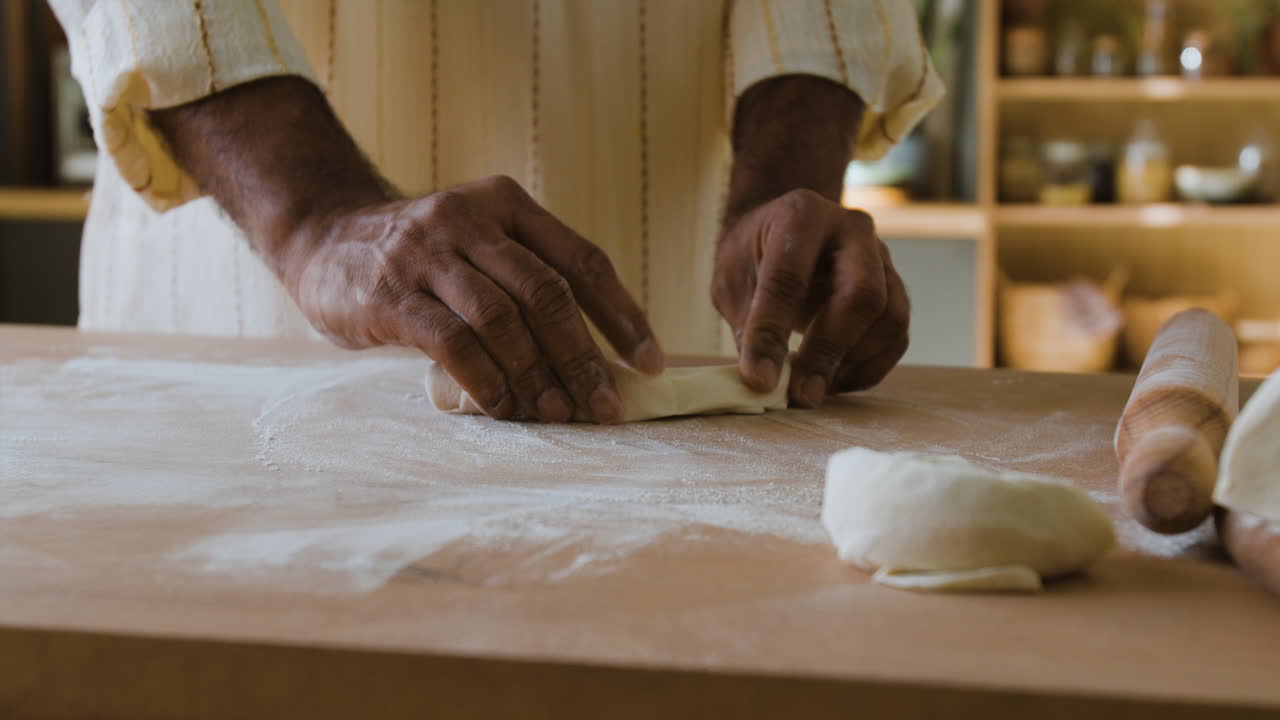 Man Kneading Dough for Baking Bread