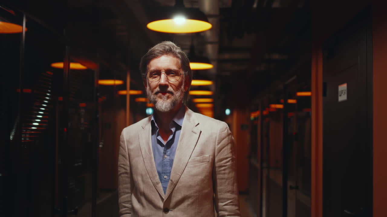 Professional Man Standing in a Modern Office Corridor
