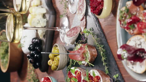 charcuterie board with cheese, olives, meats, and bread