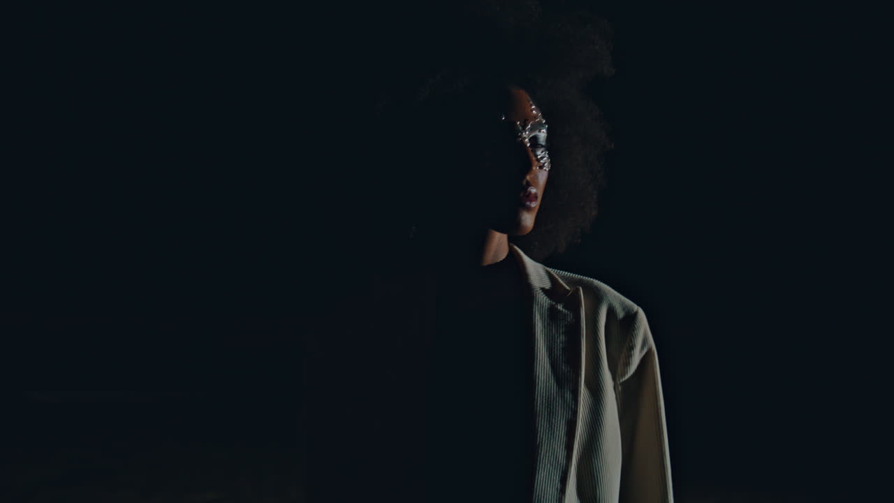 Fashion woman modeling night in fading light closeup. Attractive girl posing