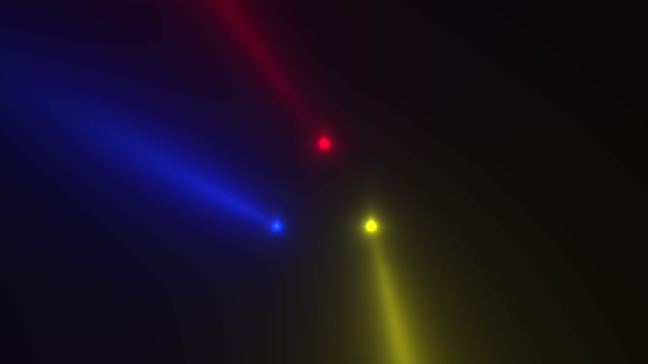 Colorful glowing spotlight beams on black gradient stage