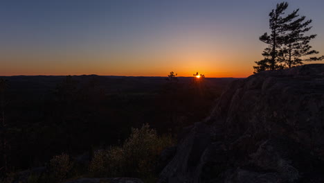 sunset time-lapse shot over the forests of michigan's upper peninsula in 4k