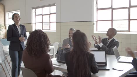 Colleagues-applauding-after-successful-presentation