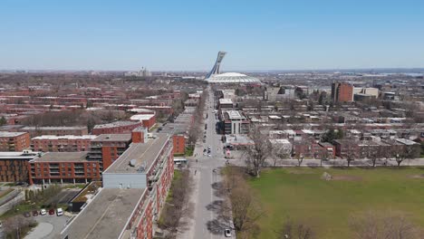 drone-revealing-olympic-stadium-in-Montreal-flying-above-Hochelaga-Maisonneuve-district