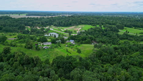 Aerial-view-rural-property-with-green-trees-and-green-fields