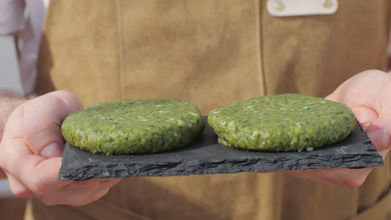 Vegan vegetarian bbq barbuque, grill Many various of green vegetables on plate close-up. Fresh artichoke, green pepper, zucchini, avocado. Cafe and restaurant food.