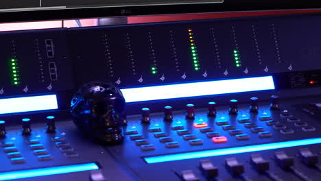 overview of the mixing board with black skull