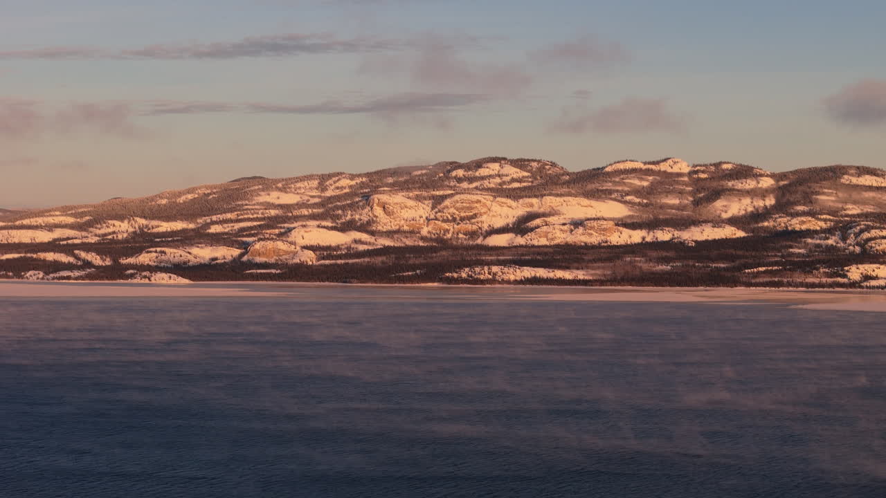 Lake Laberge During Sunset Of Winter In Yukon, Canada - Drone Shot