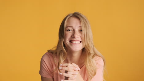 caucasian woman celebrating victory on camera.