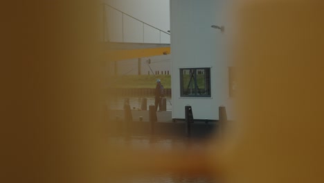 Narrow-view-through-anchors-on-shore-on-a-passing-boat