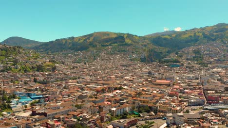 Above-the-rooftops-of-Quito-the-capital-city-of-Ecuador-in-South-America,-aerial