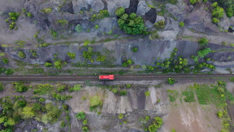 Straight-red-train-track-running-along-with-the-farm-fields-in-Hungary