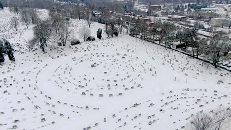 Winter-snow-at-cemetery-graveyard-burial-site-in-Lancaster,-Pennsylvania,-USA
