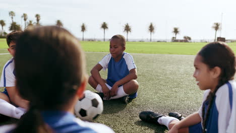 children, ball and game on field while sitting