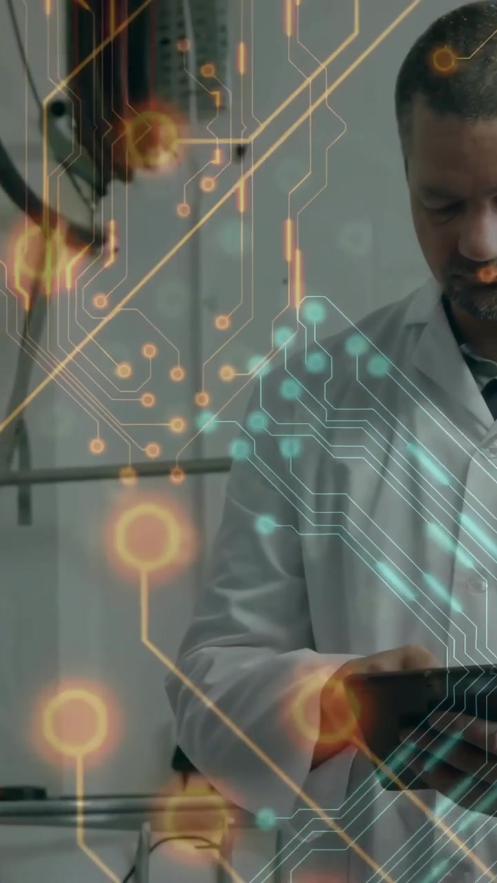 Vertical video: Camera pan revealing tech tapping tablet while circuit grid moving to monitor plant