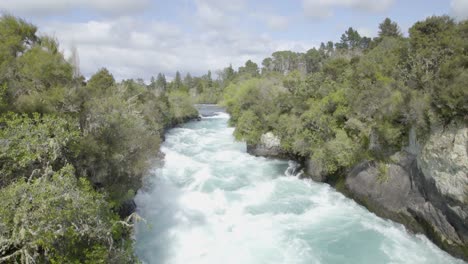 a wide shot looking towards the start of the huka falls in taupo, nz