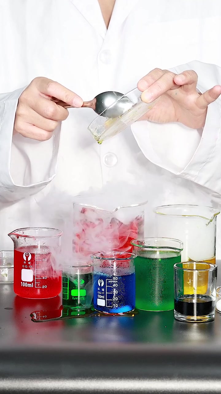 Scientist conducting experiment with colorful liquids