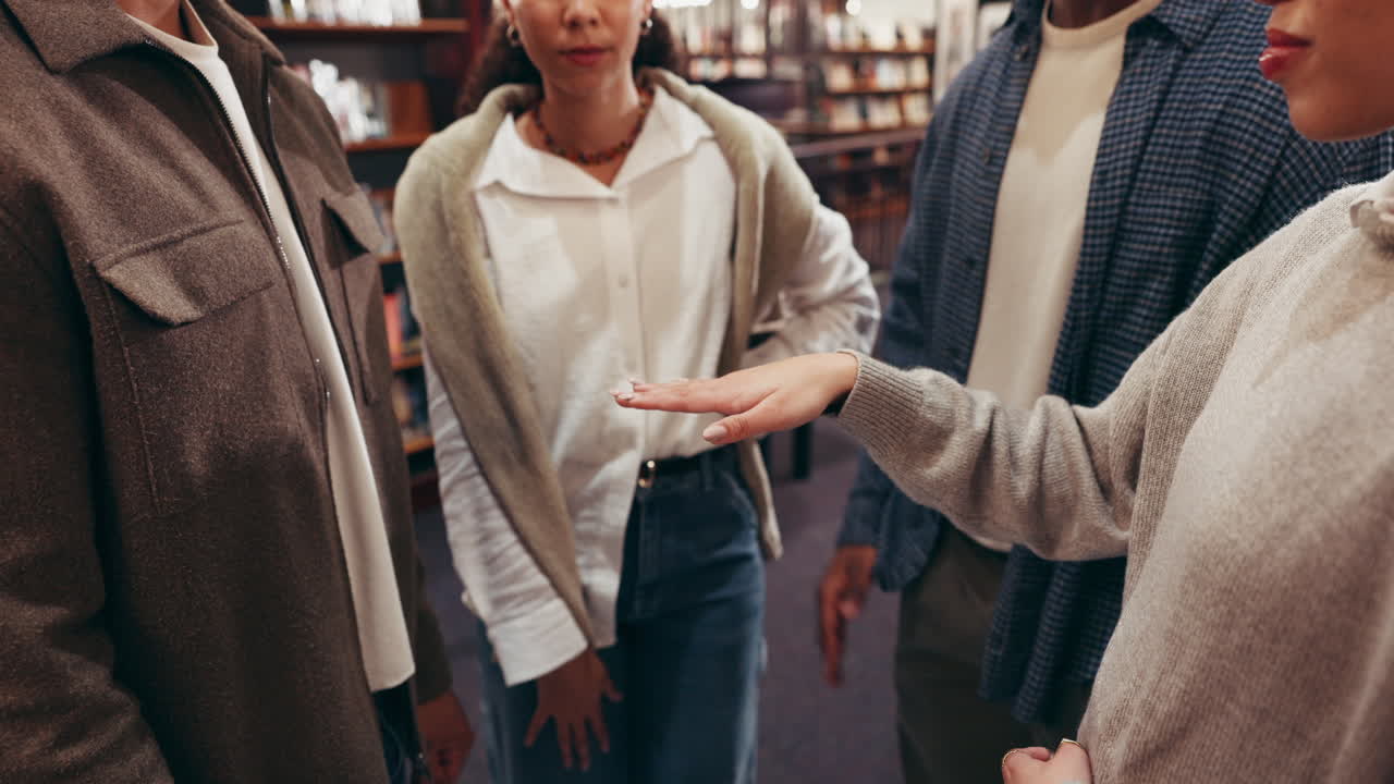 Group of people showing teamwork and collaboration in library