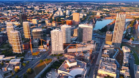 flight over the modern urban landscape of bratislava, slovakia. some new buildings being built in the sight. aerial view