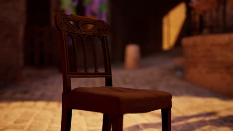 a close up of an antique wooden chair in a dimly lit room