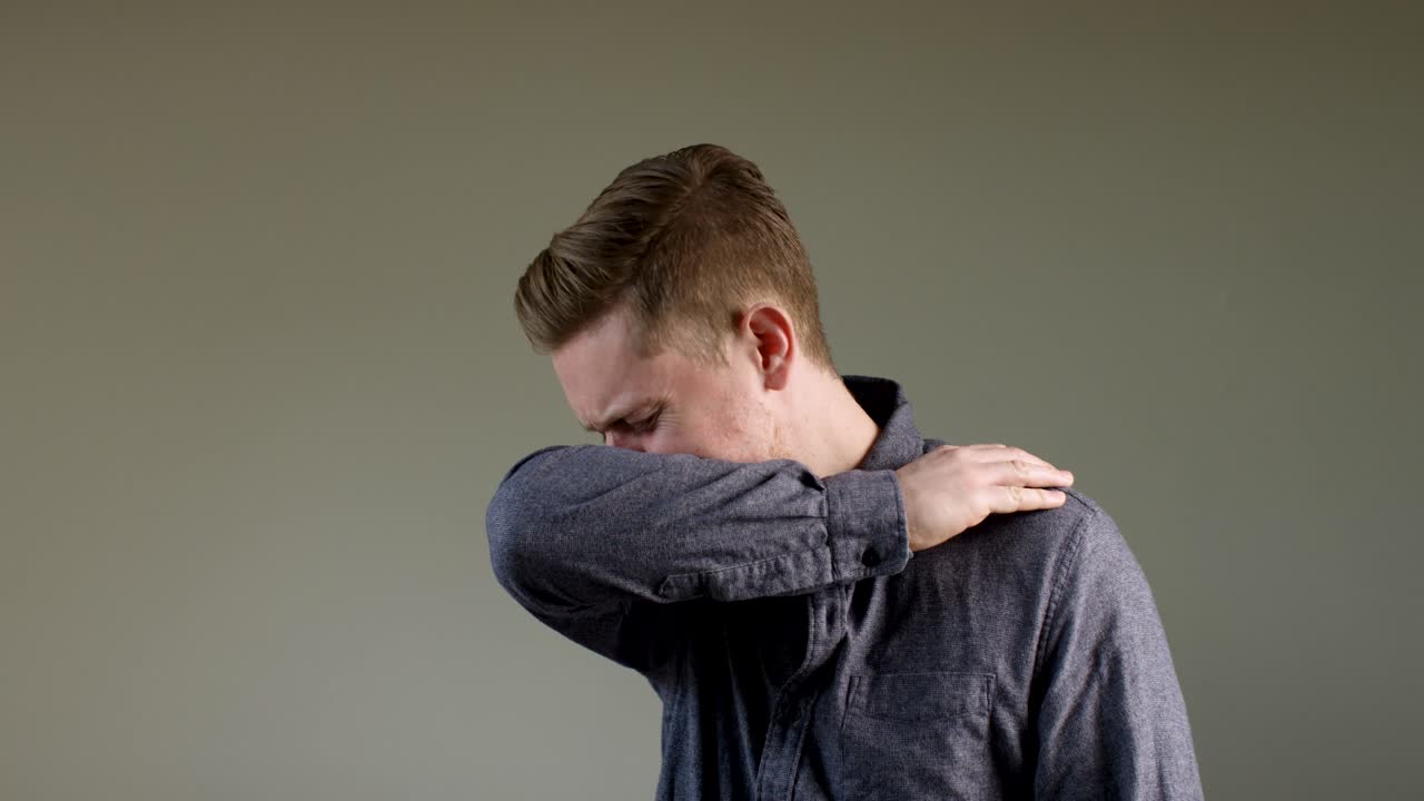 European Man Coughs Into Arm In Slow Motion A