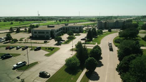 car-hauler-pickup-truck-driver-is-driving-towards-interstate-4k-drone-footage