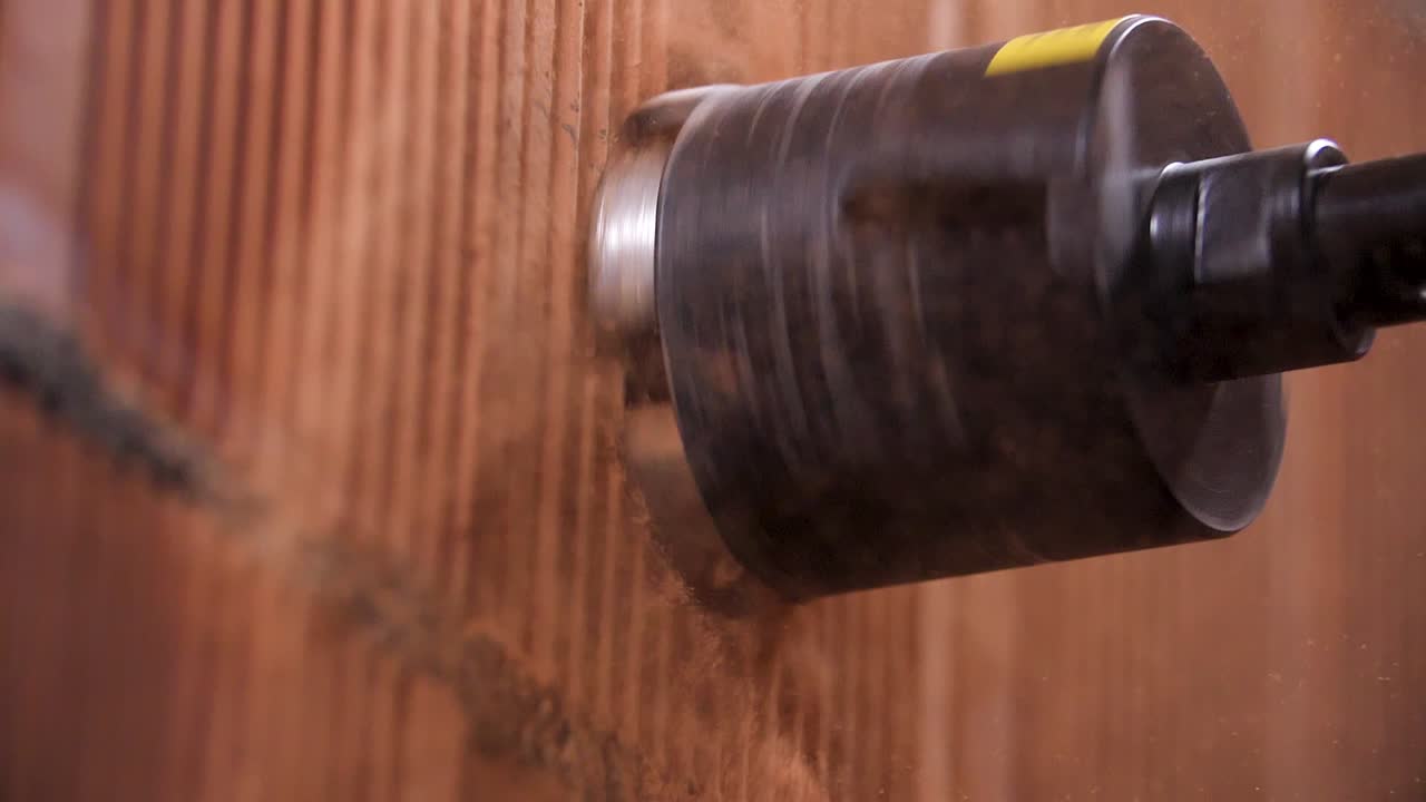 Drilling a hole in a brick wall