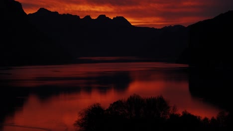 dramatic sunset over a mountain lake