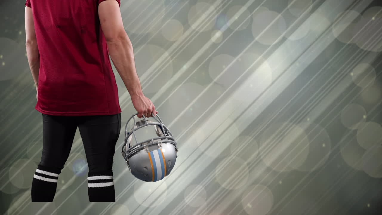 animación de un jugador de fútbol americano caucásico sobre rastros de luz y puntos en un fondo gris