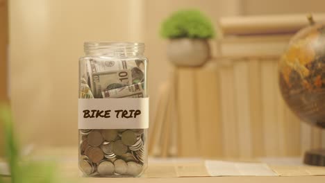 person saving money for bike trip