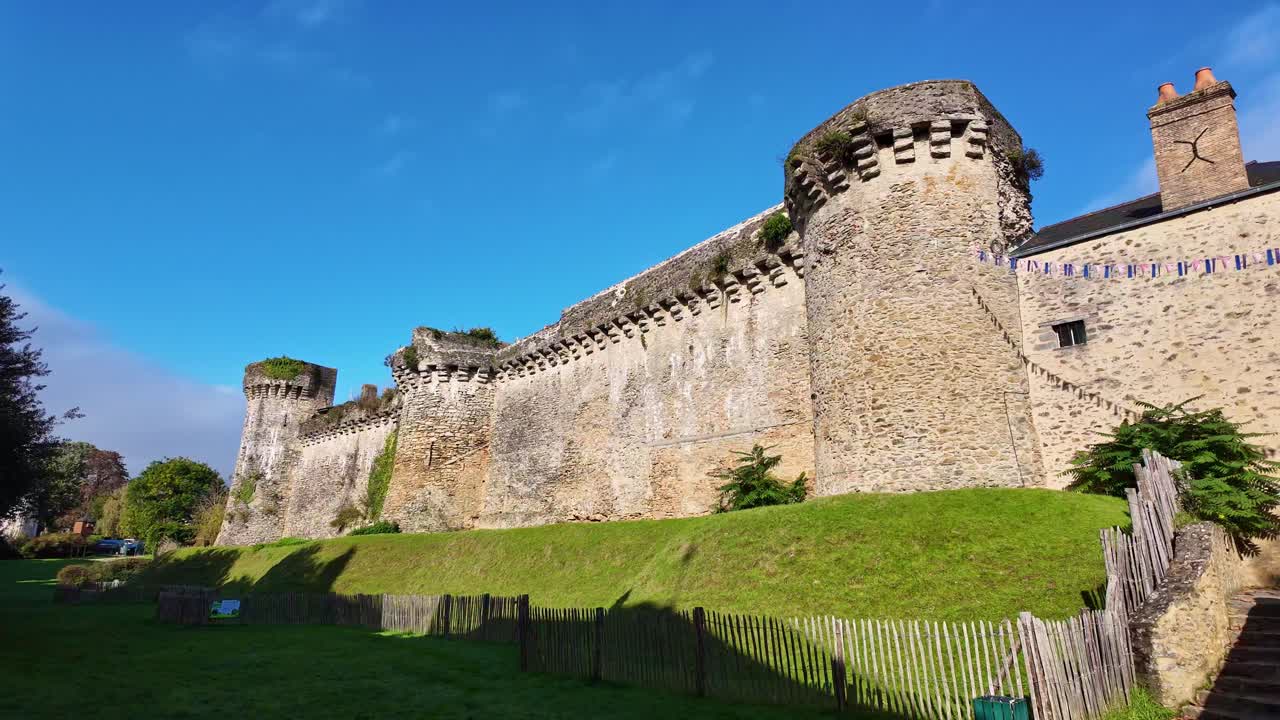 Southern ramparts stone fortress exterior view in panning movement, Laval, France.