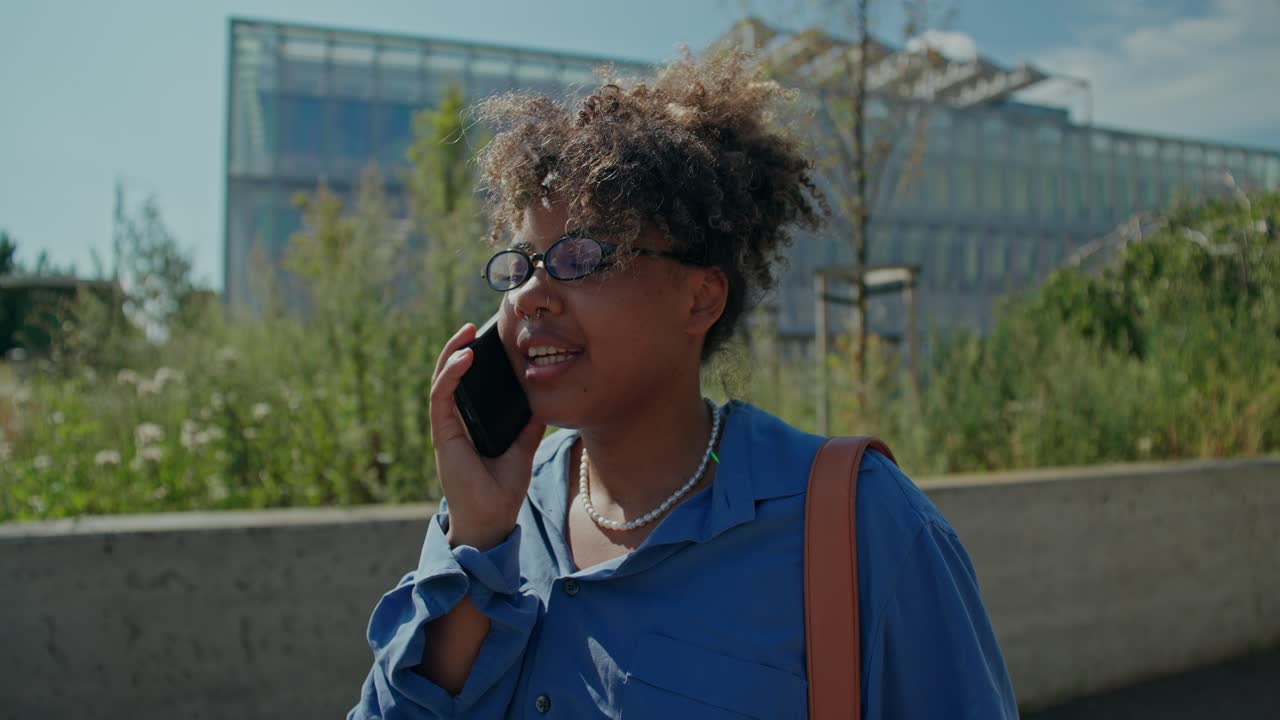 Woman talking on the phone outdoors