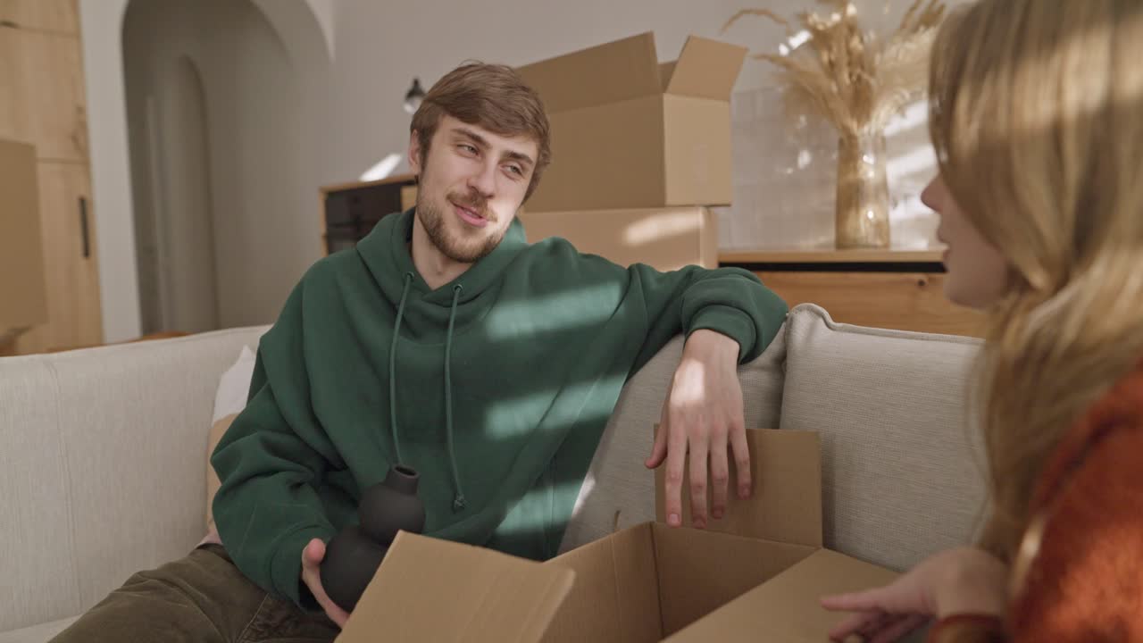 Couple Unpacking Boxes in Their New Home