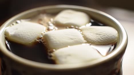 a delightful cup of hot cocoa with melting marshmallows: the perfect winter beverage for warmth and comfort