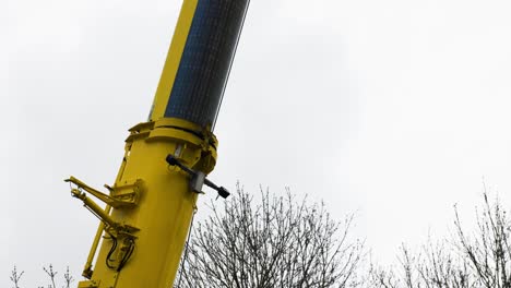 yellow pipe crane working on construction