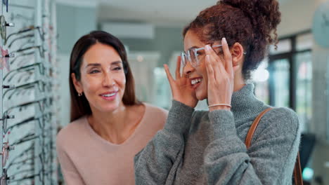 women shopping for eyeglasses at an optical store