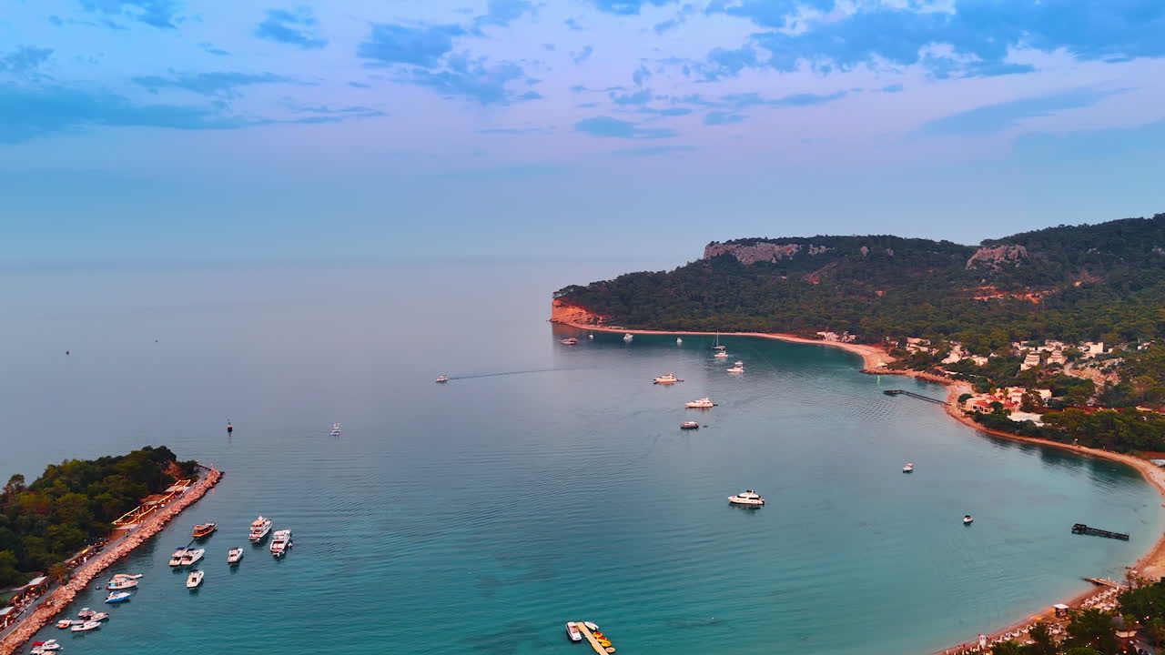 Beautiful bay at the shore of the Mediterranean Sea. Boats and yachts are on the waterscape and at the coast. Kemer, Turkey aerial view
