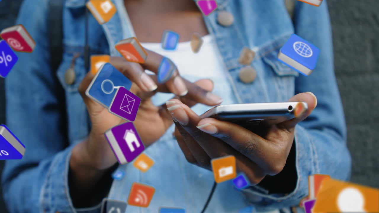 Colourful cubes falling down while woman uses smartphone in background