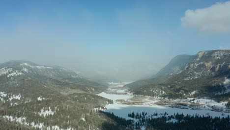 Aerial-view-of-Colorado-mountain-valley-in-winter-with-snowy-meadow