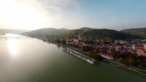peaceful aerial shot of the cities krems and stein in lower austria, filmed with an fpv hovering over the danube
