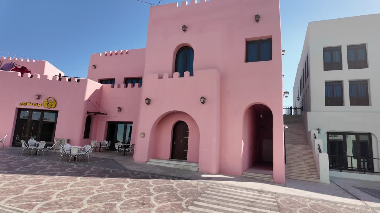 Pink and White Buildings in a Cityscape