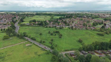 drone view of wicksteed park with cityscape at background in england