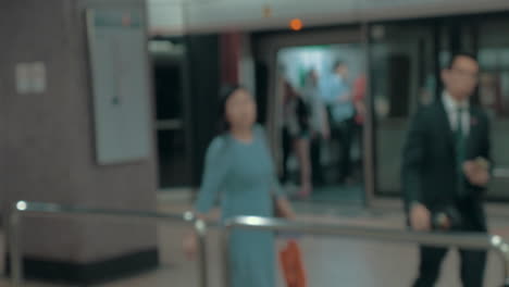 Young-blond-woman-wearing-surgical-mask-in-the-entrance-of-clinic-Hong-Kong-China