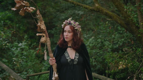 young-druid-girl-walks-in-a-forest-medium-shot