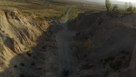 drone following russian jeep - driving off-road - kyrgyzstan