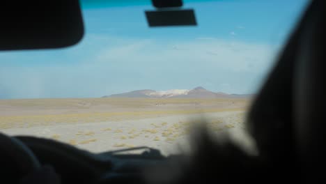 driving through the desert in uyuni, bolivia