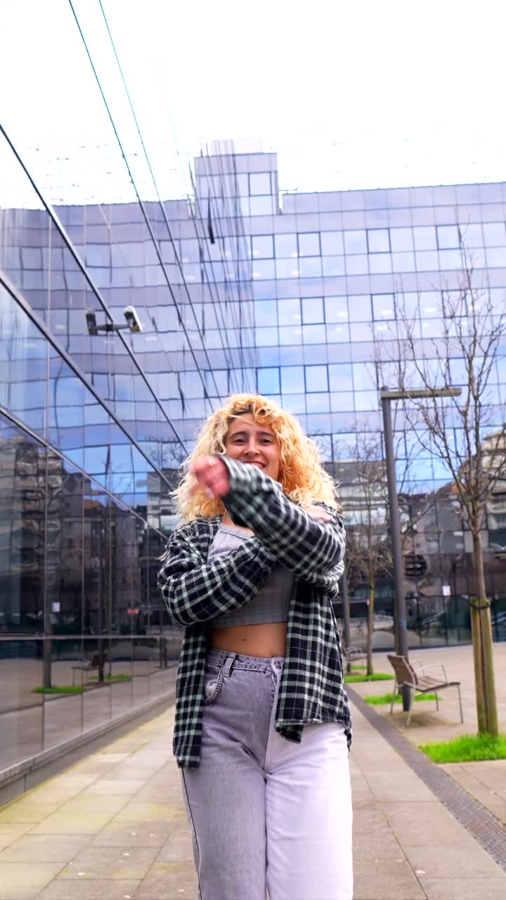 Woman in Trendy Outfit Dancing in the City