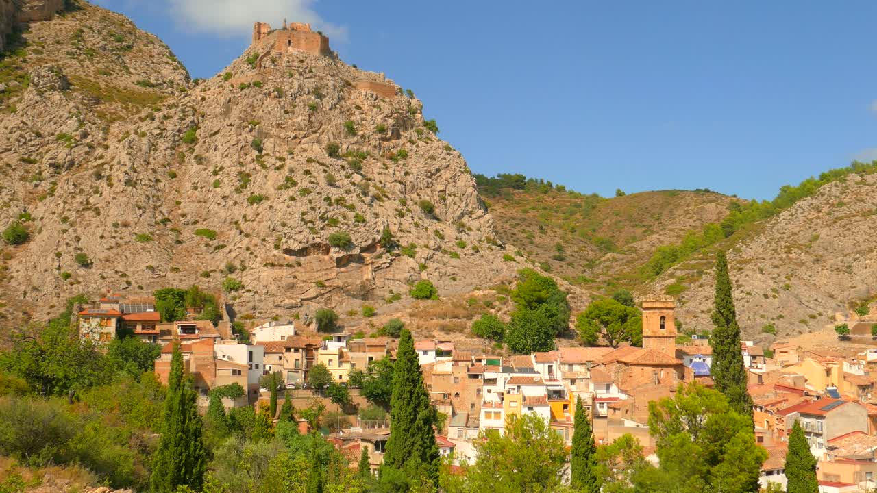 Panoramic view of old Spanish village in mountainous area, View of castle ruins in Borriol, Spain
