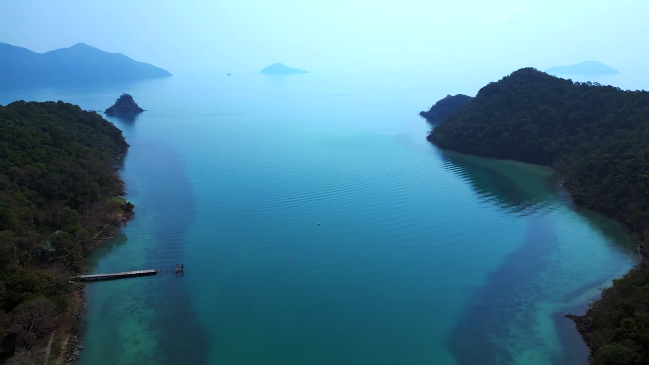 Scenic aerial view of lush green hills and turquoise waters on Koh Chang Ngam Island. Amazing aerial view flight panorama overview drone