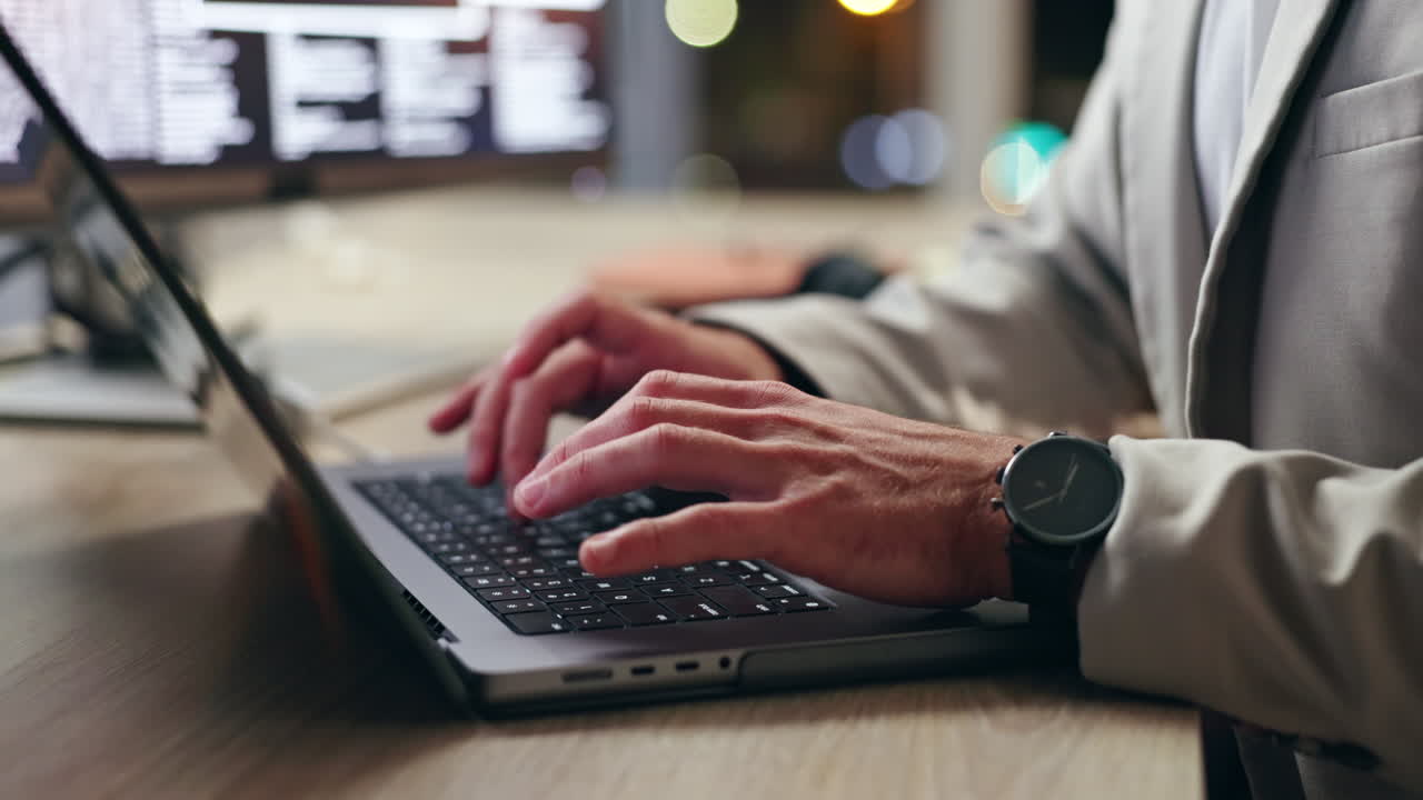 Typing on a laptop at the office
